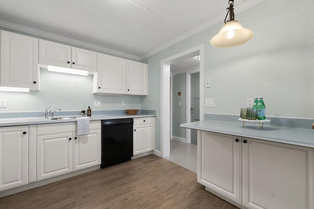 kitchen with ornamental molding, black dishwasher, light countertops, and white cabinets