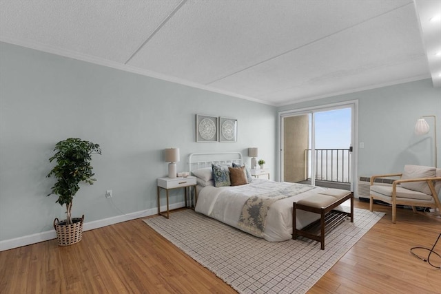 bedroom featuring crown molding, access to outside, baseboards, and light wood-style flooring