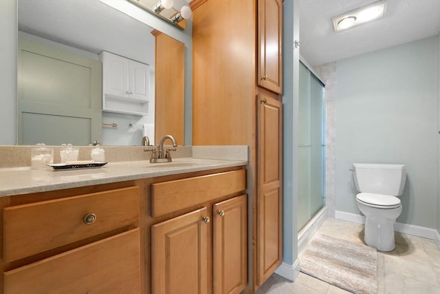 full bath with a stall shower, toilet, baseboards, tile patterned flooring, and vanity