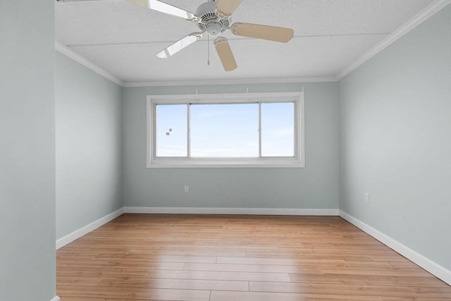 unfurnished room featuring light wood finished floors, ornamental molding, and a textured ceiling