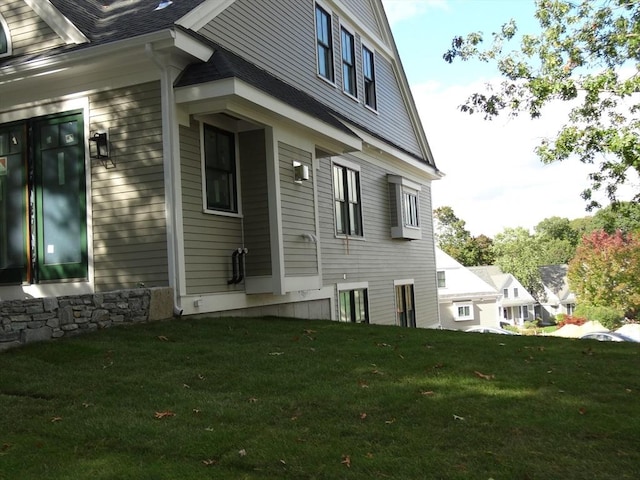 view of home's exterior with a lawn