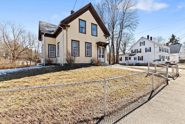 view of front of property featuring entry steps, a chimney, and fence private yard