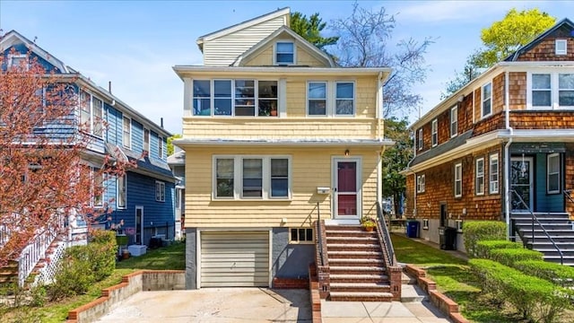 13 Conwell Ave, Somerville, MA 02144 - traditional style home with driveway, stairs, and a garage