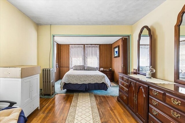 13 Conwell Ave, Somerville, MA 02144 - bedroom with wood-type flooring and radiator heating unit