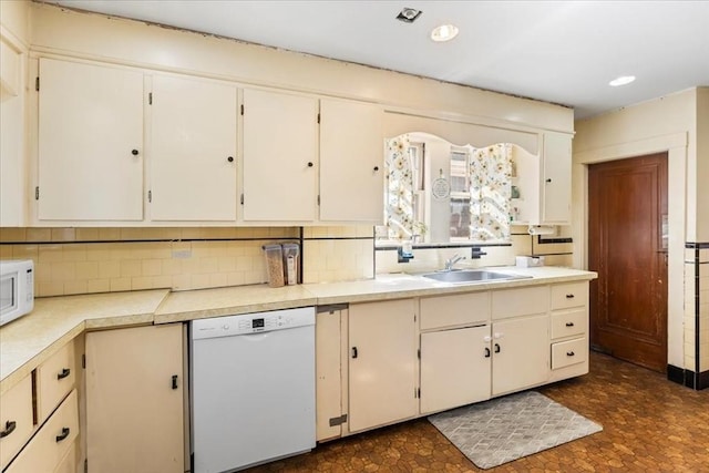 13 Conwell Ave, Somerville, MA 02144 - kitchen featuring light countertops, a sink, white appliances, and tasteful backsplash