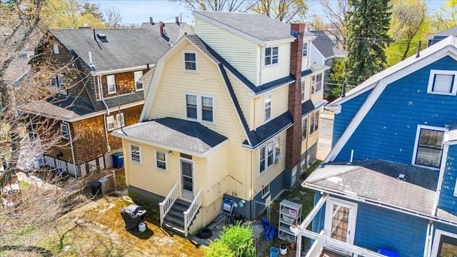13 Conwell Ave, Somerville, MA 02144 - back of property with roof with shingles, a chimney, and a gambrel roof