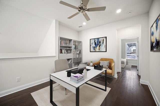 office with dark hardwood / wood-style floors and ceiling fan