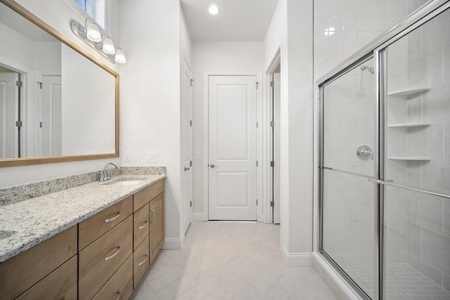 bathroom with vanity and walk in shower