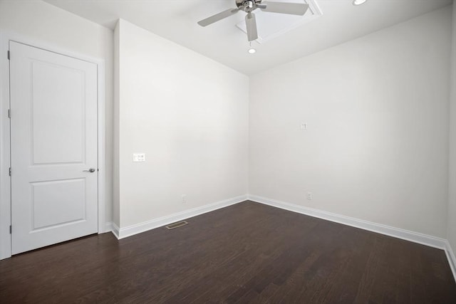 empty room with dark hardwood / wood-style floors and ceiling fan