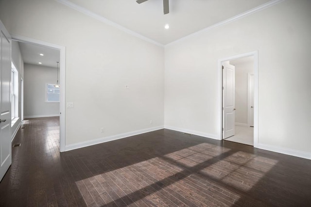 spare room with ornamental molding, dark hardwood / wood-style floors, and ceiling fan