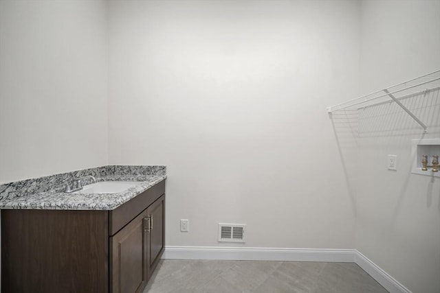 bathroom featuring tile patterned floors and vanity