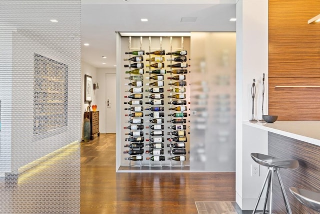 wine cellar with recessed lighting and wood finished floors
