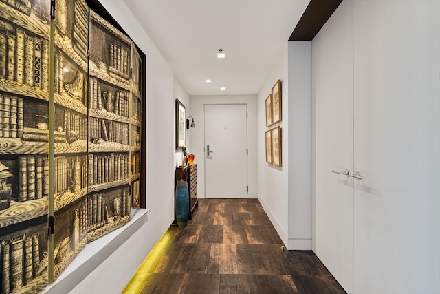 hall featuring recessed lighting and wood finished floors