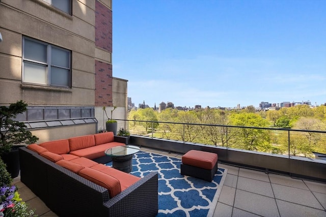 balcony featuring a view of city and an outdoor hangout area