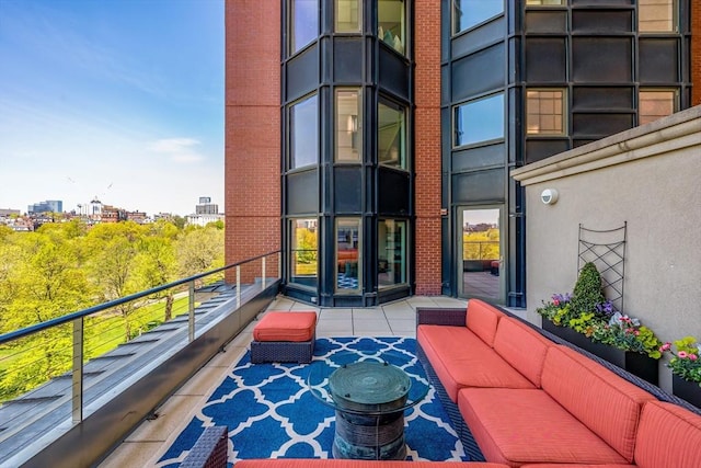 balcony with a view of city and an outdoor living space