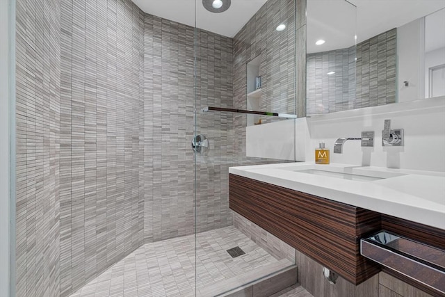 full bath with a sink and a stall shower