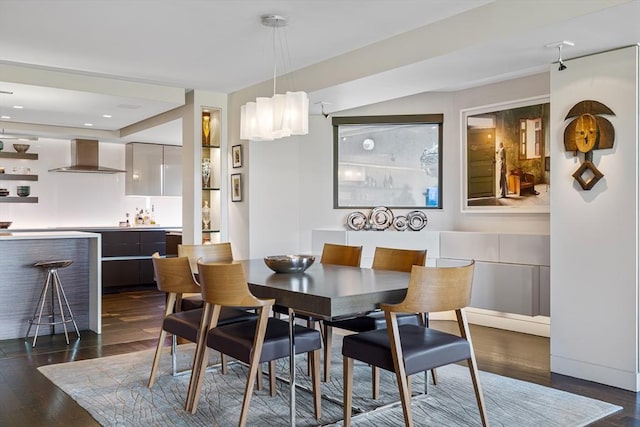 dining room featuring dark wood finished floors and bar