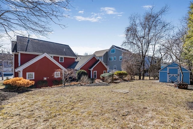 view of front of house with a storage shed and an outdoor structure