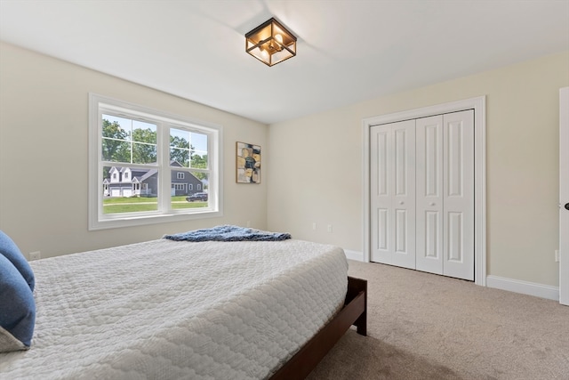 carpeted bedroom with a closet