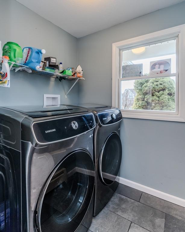 clothes washing area featuring tile patterned floors and independent washer and dryer