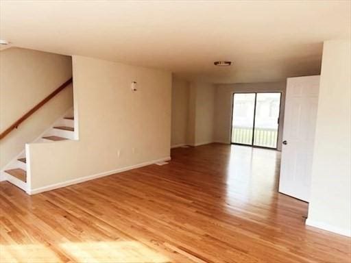 unfurnished room featuring wood-type flooring