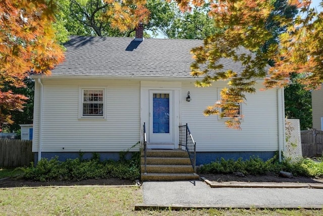 22 Willis Lake Dr, Sudbury, MA 01776 - view of front of home with a chimney and a shingled roof