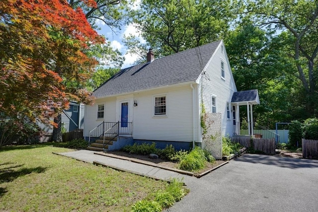 22 Willis Lake Dr, Sudbury, MA 01776 - view of front of property featuring a chimney, roof with shingles, and asphalt driveway