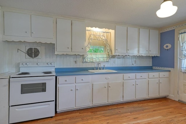 22 Willis Lake Dr, Sudbury, MA 01776 - kitchen featuring electric stove, white cabinets, light wood-type flooring, and a textured ceiling