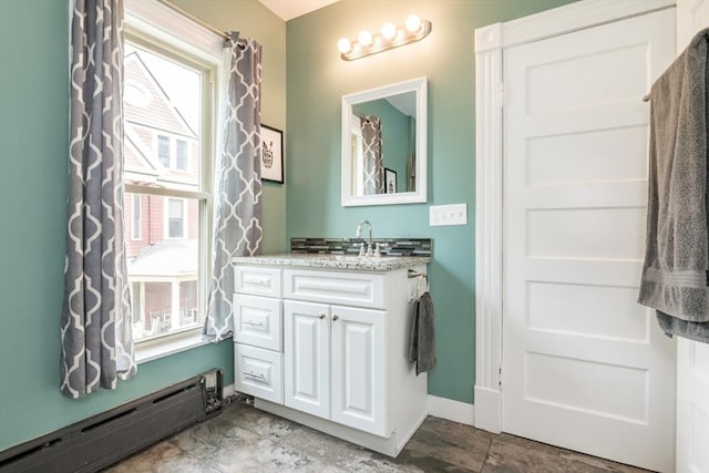 61 Fairfield Ave, Holyoke, MA 01040 - bathroom with a baseboard heating unit, vanity, and baseboards