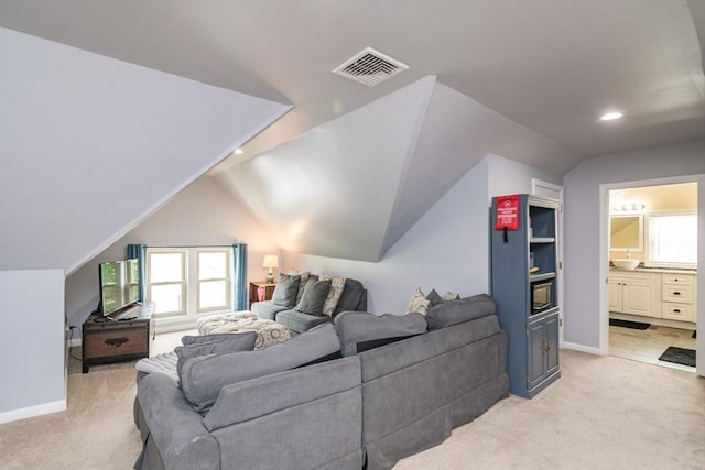 61 Fairfield Ave, Holyoke, MA 01040 - living room featuring light colored carpet, lofted ceiling, recessed lighting, and baseboards