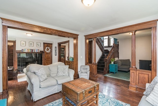 61 Fairfield Ave, Holyoke, MA 01040 - living room with wood finished floors, stairway, and decorative columns