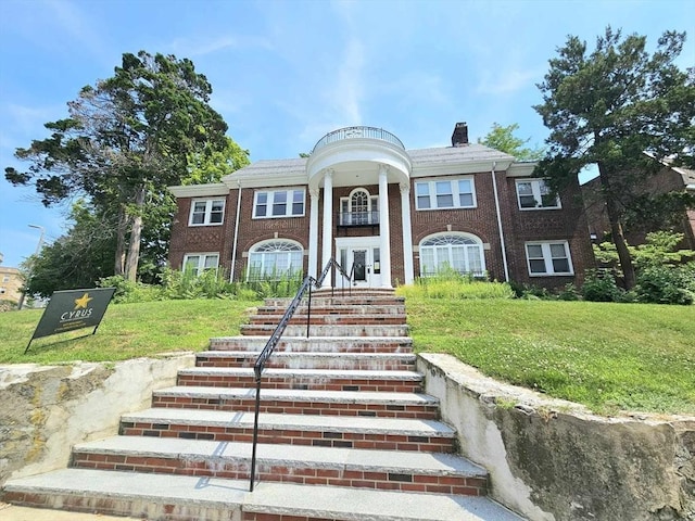 332 Jamaicaway Unit 2, Boston, MA 02130 - neoclassical / greek revival house featuring a chimney, a front lawn, french doors, and brick siding