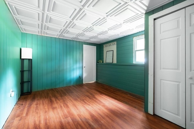 4 Charles River Rd, Medway, MA 02053 - spare room with an ornate ceiling, wood finished floors, and wooden walls