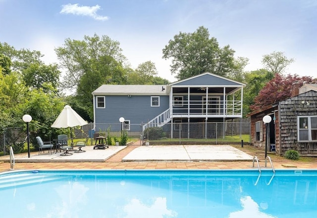 4 Charles River Rd, Medway, MA 02053 - view of pool featuring a patio area, an outbuilding, a sunroom, and stairs