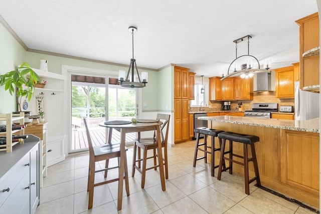 4 Charles River Rd, Medway, MA 02053 - kitchen featuring appliances with stainless steel finishes, wall chimney exhaust hood, a chandelier, light stone countertops, and tasteful backsplash