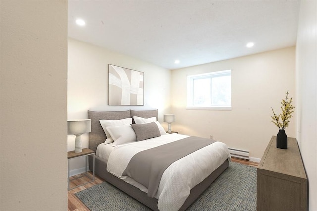 770 Cummins Hwy Unit 12, Boston, MA 02126 - bedroom featuring a baseboard radiator, wood finished floors, and recessed lighting