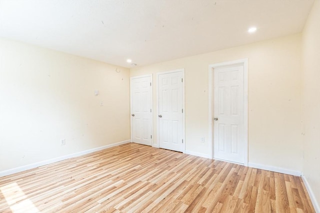 770 Cummins Hwy Unit 12, Boston, MA 02126 - unfurnished bedroom featuring light wood-type flooring and recessed lighting