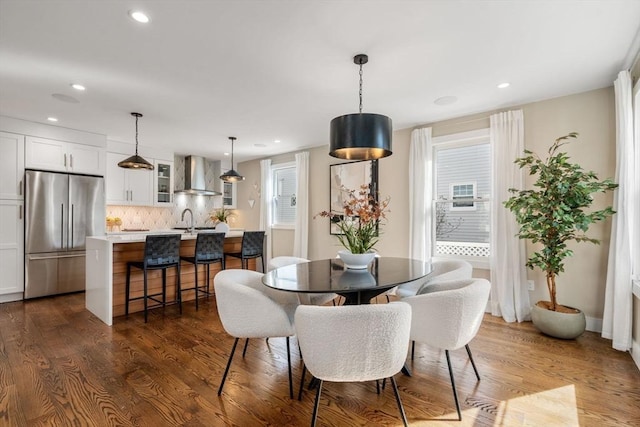 dining room with recessed lighting and dark wood finished floors