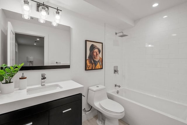 bathroom featuring vanity, toilet, washtub / shower combination, and recessed lighting