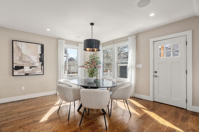 dining room with visible vents, recessed lighting, baseboards, and wood finished floors