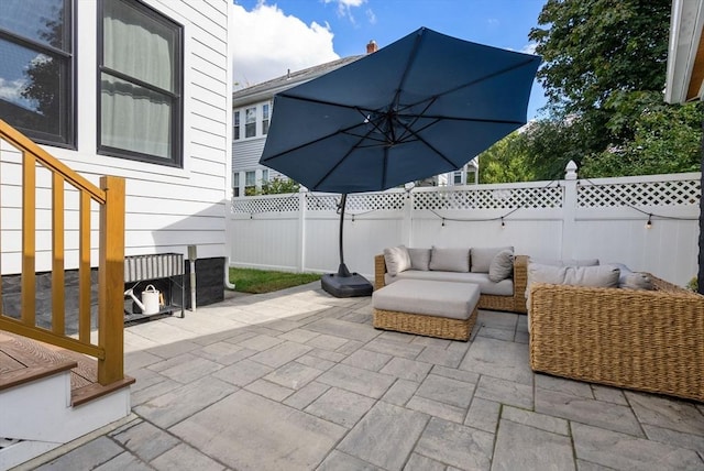 view of patio with an outdoor hangout area and a fenced backyard