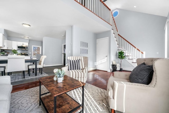 living room with a baseboard radiator and hardwood / wood-style floors