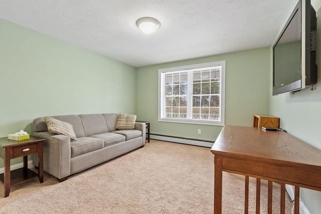 living room featuring a baseboard heating unit and carpet