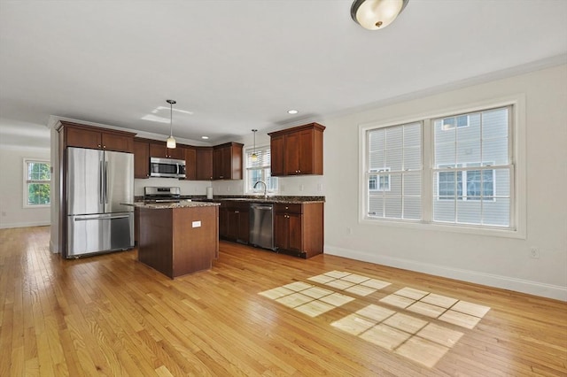 8 School St Unit 1, Waltham, MA 02452 - kitchen with appliances with stainless steel finishes, baseboards, light wood-style flooring, and recessed lighting