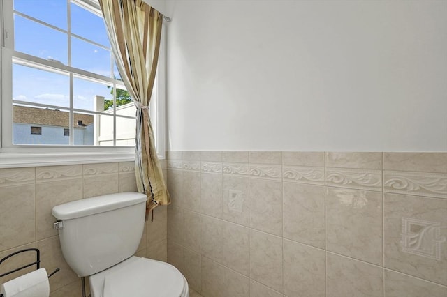 8 School St Unit 1, Waltham, MA 02452 - bathroom with toilet, tile walls, and wainscoting