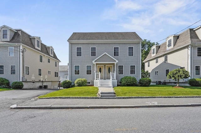 8 School St Unit 1, Waltham, MA 02452 - view of front of property with a front lawn and central air condition unit