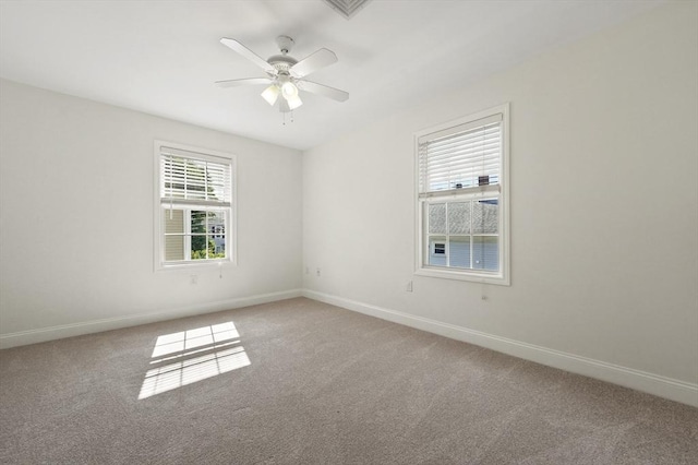 8 School St Unit 1, Waltham, MA 02452 - empty room with light colored carpet, baseboards, and a ceiling fan