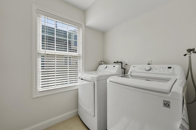 8 School St Unit 1, Waltham, MA 02452 - washroom with washer and clothes dryer, baseboards, and light tile patterned floors