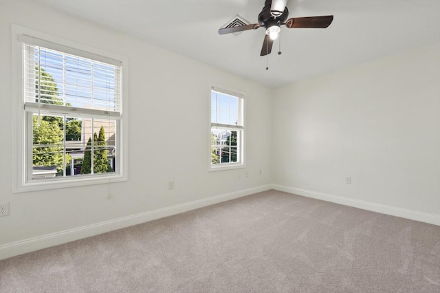 8 School St Unit 1, Waltham, MA 02452 - empty room with light carpet, baseboards, and ceiling fan