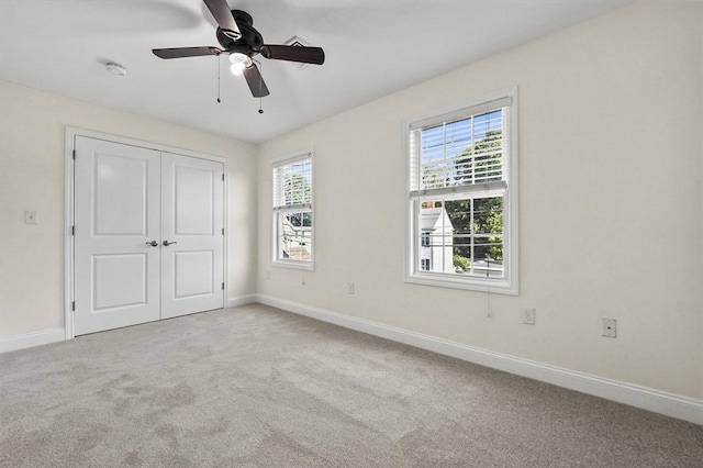 8 School St Unit 1, Waltham, MA 02452 - unfurnished bedroom with carpet, baseboards, and a closet